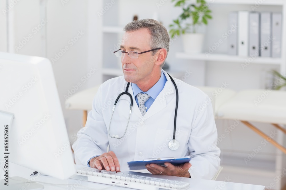 Concentrating doctor using computer Concentrating doctor using computer