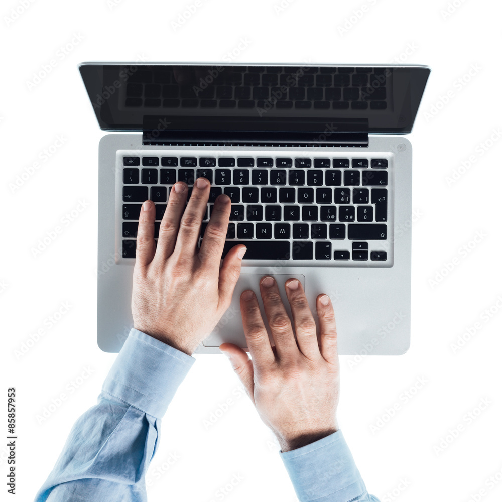 Businessman typing on a laptop Businessman typing on a laptop