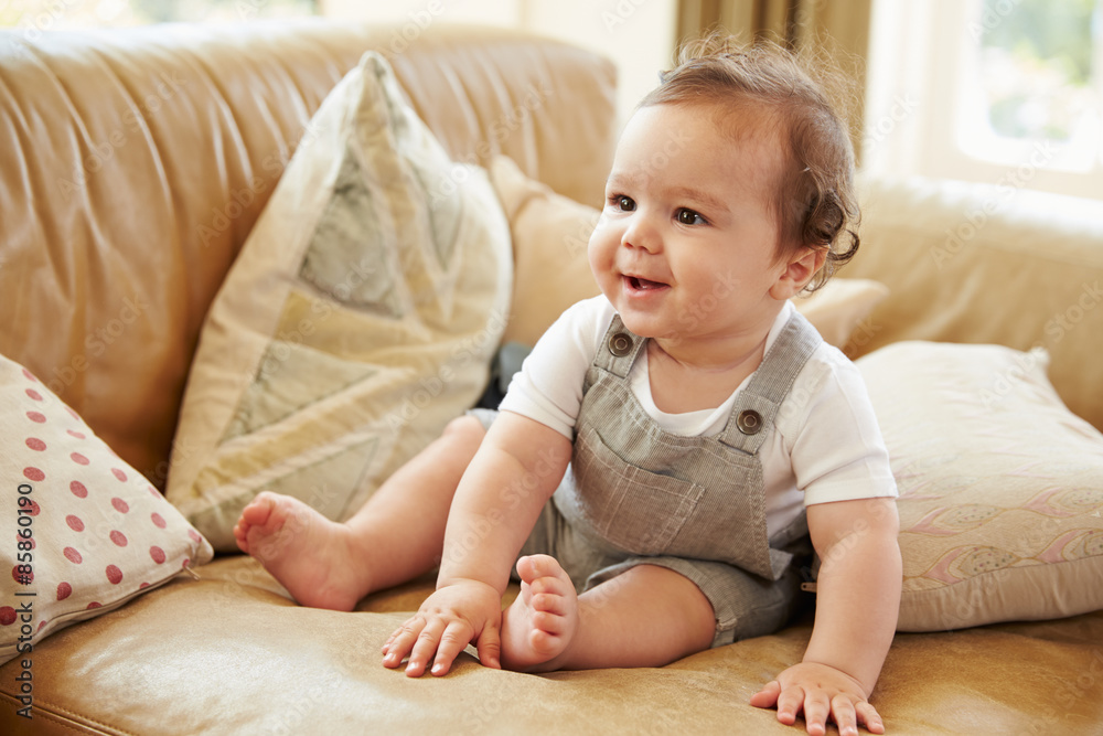 Happy Baby Boy Playing On Sofa At Home Happy Baby Boy Playing On Sofa At Home