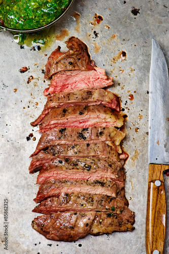 flank steak  with chimichurri sauce.