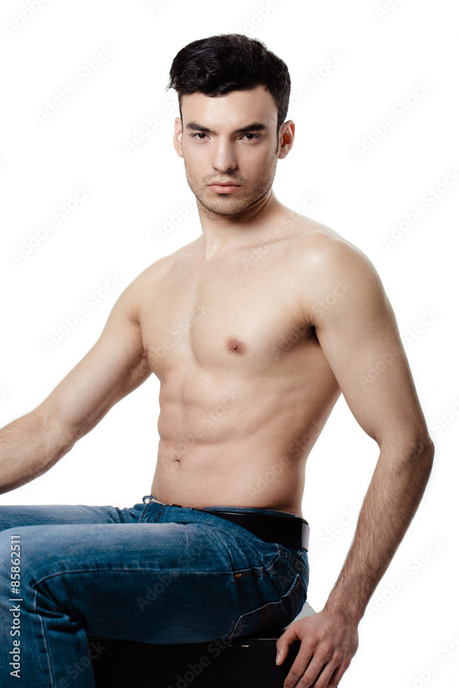 Fototapeta premium Healthy muscular young man. Isolated on white background