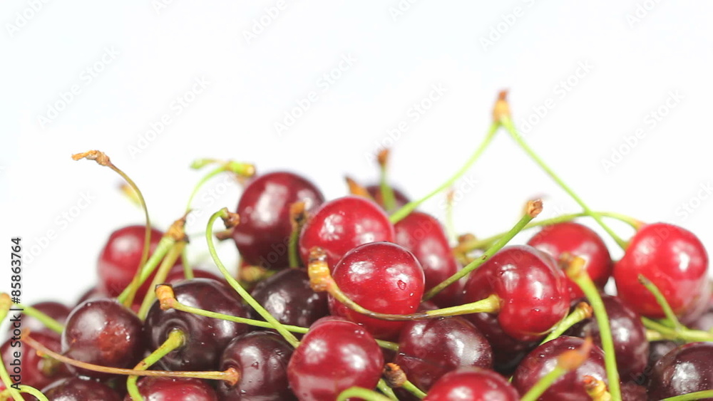 Cherries slowly rotating on white background Cherries slowly rotating on white background