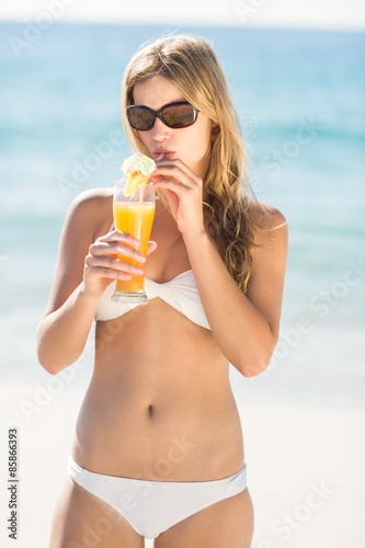 blonde drinking a cocktail