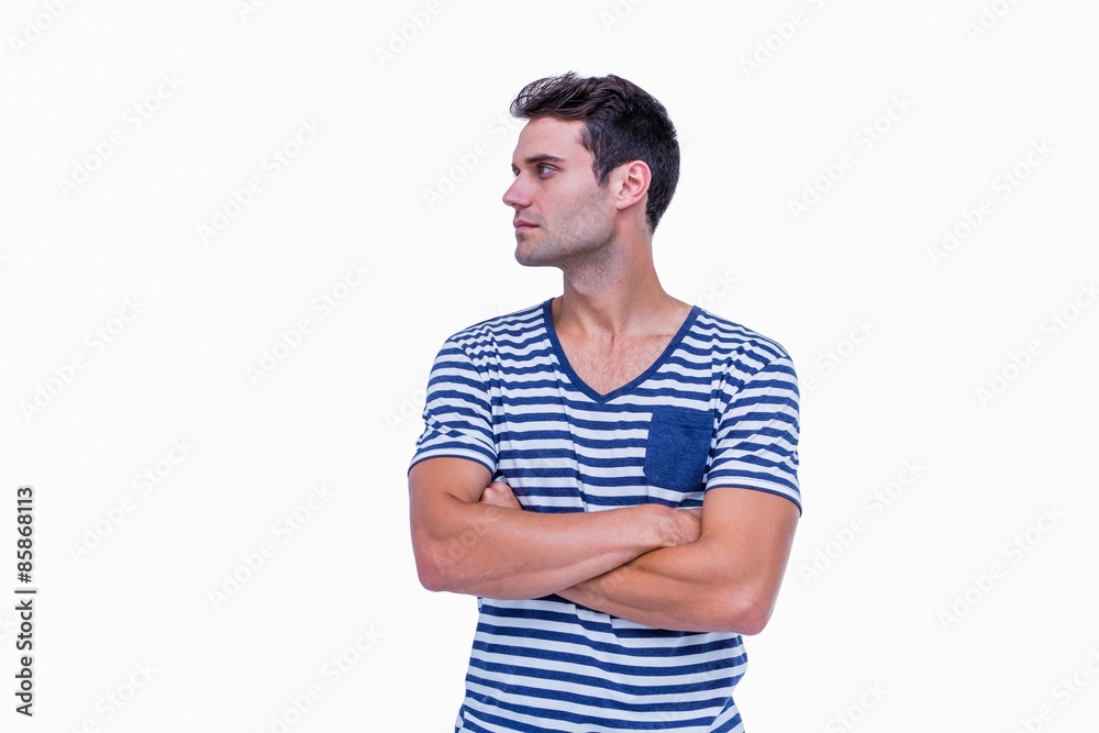 Handsome hipster looking away with arms crossed Handsome hipster looking away with arms crossed