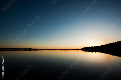 Sundown and calm lake