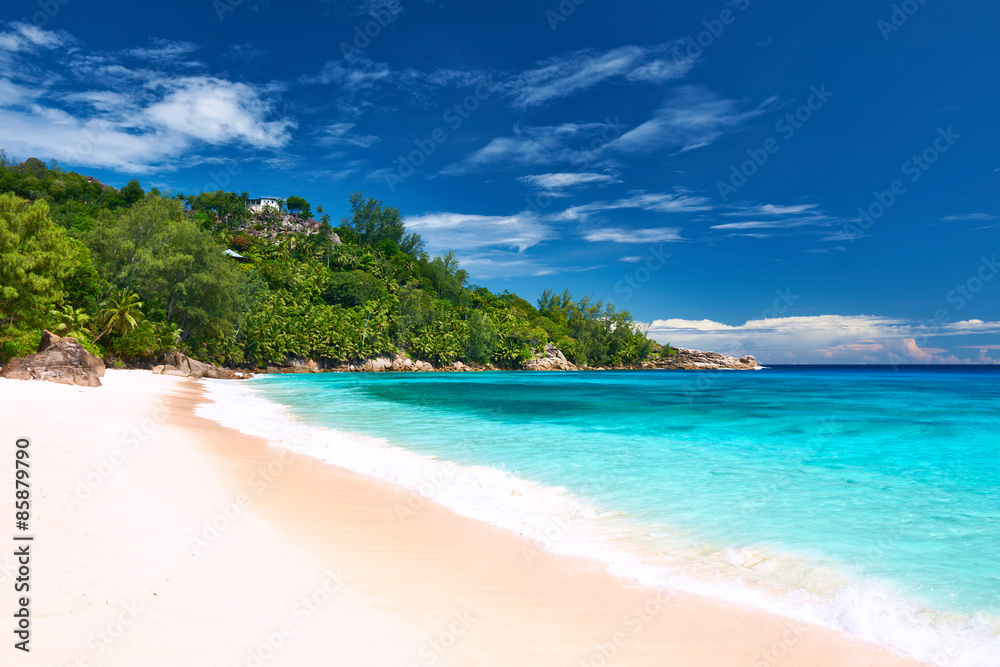 Beautiful island beach with motor boat