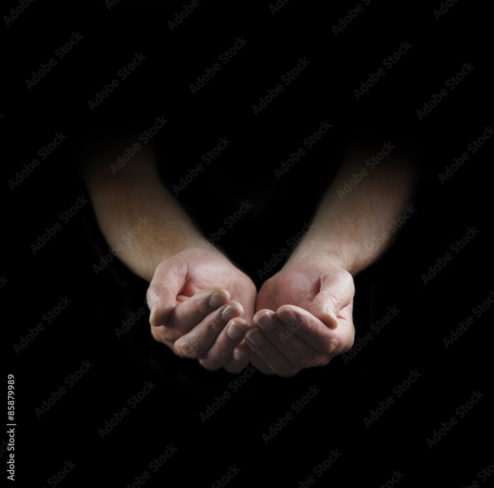 Please Help - Man's cupped hands emerging from darkness with plenty of copy space around Please Help - Man's cupped hands emerging from darkness with plenty of copy space around