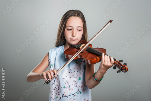 The young girl playing the violin