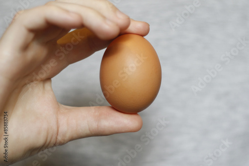 Man holds an egg in his hand