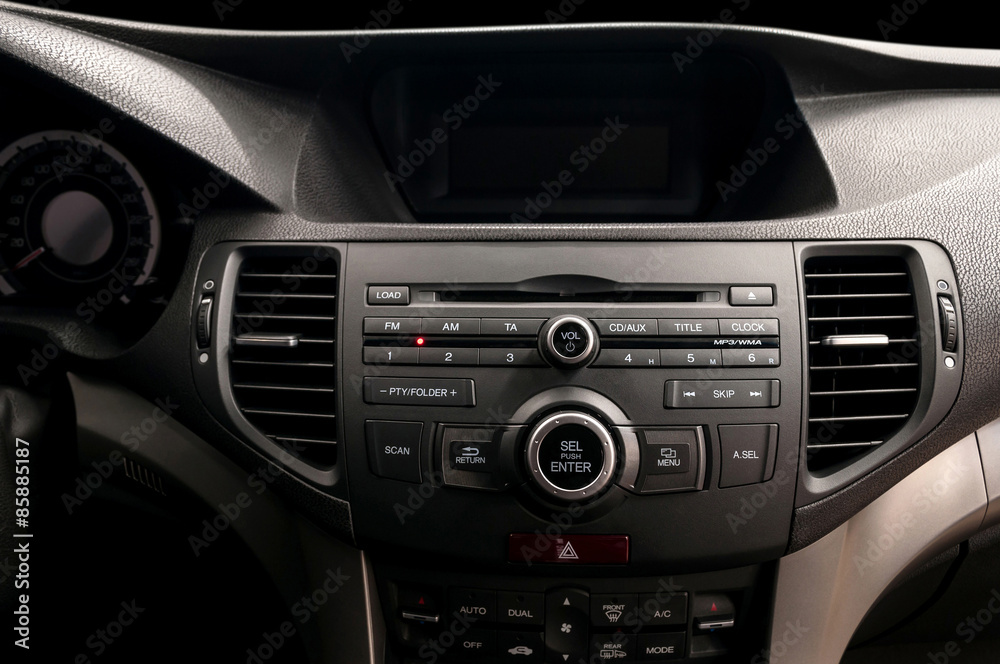 Modern car dashboard. Multimedia control system. Interior detail.