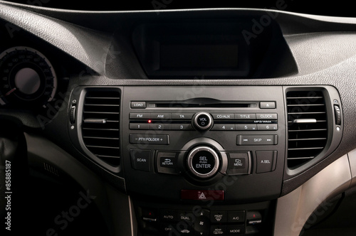 Modern car dashboard. Multimedia control system. Interior detail. © alexdemeshko