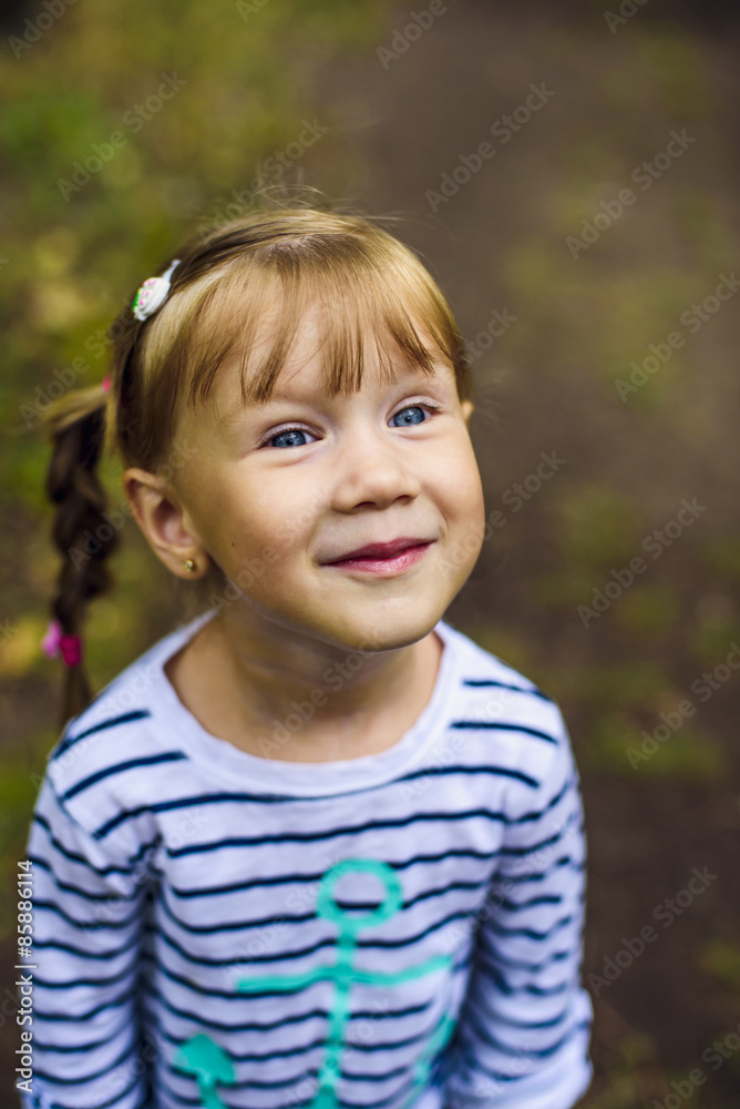 little happy girl playing in the park, baby laughing and having fun little happy girl playing in the park, baby laughing and having fun