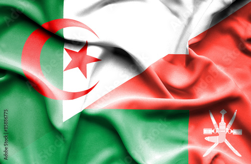 Waving flag of Oman and Algeria