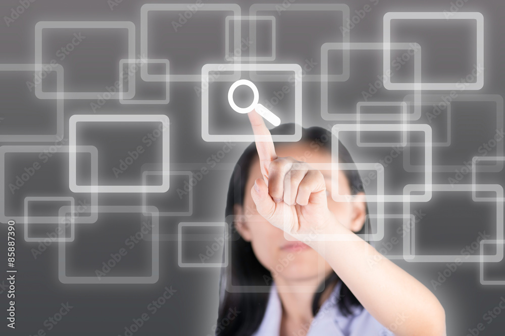 Girl pushing magnifying glass button with technology background Girl pushing magnifying glass button with technology background