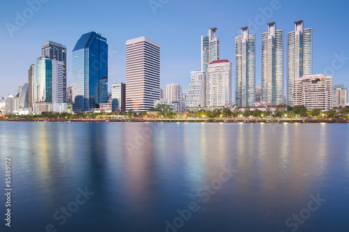 Bangkok city downtown twilight with water reflection of skyline Benjakitti ParkBangkokThailand photo