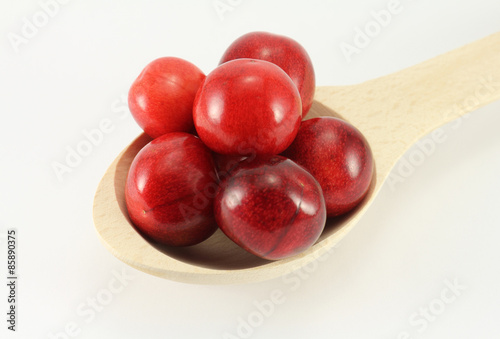 Abstract view cherry in a wooden spoon