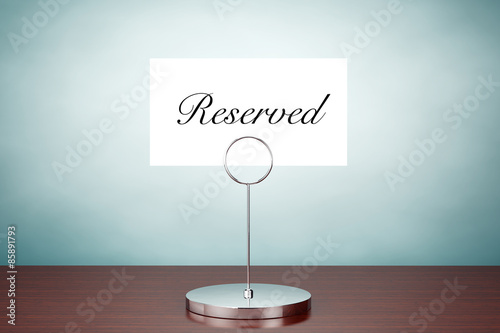 Old Style Photo. Note Paper Card Holder with Reserved Sign photo