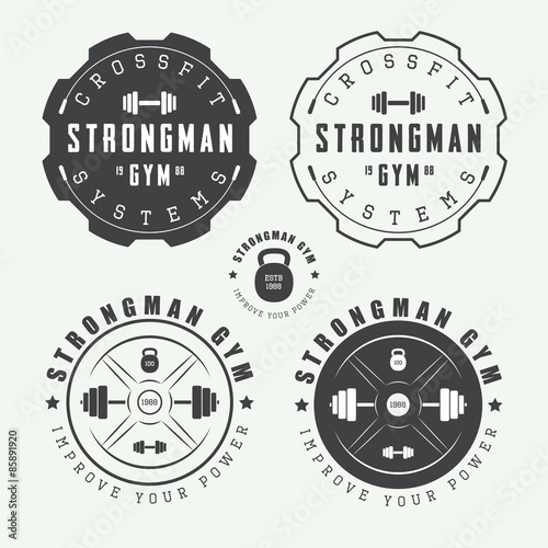 Set of gym logos, labels and slogans in vintage style