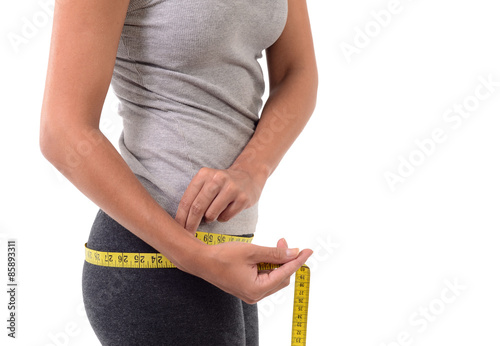 Fitness woman measuring her body