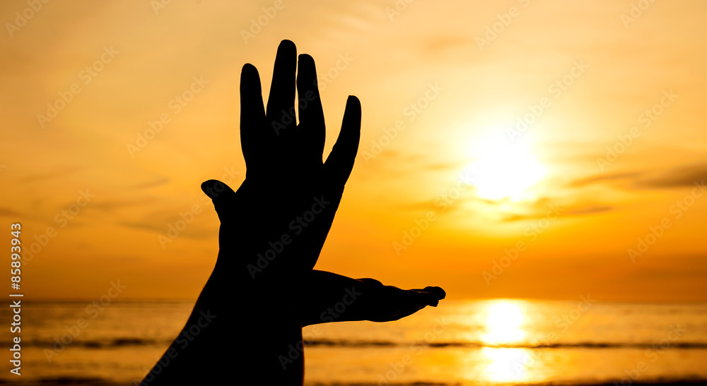 Hand with sunset