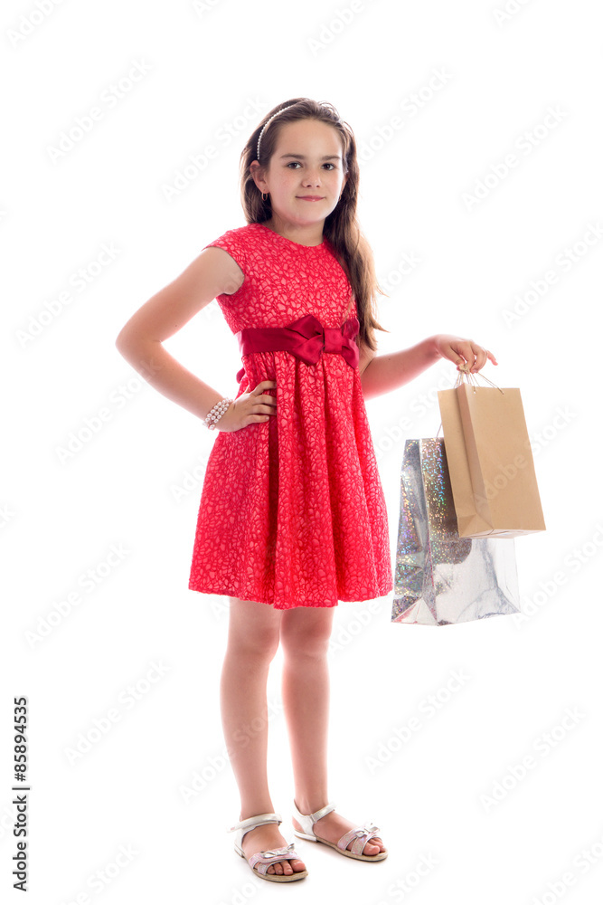 shopping concept - cute little girl with bags isolated on white background shopping concept - cute little girl with bags isolated on white background