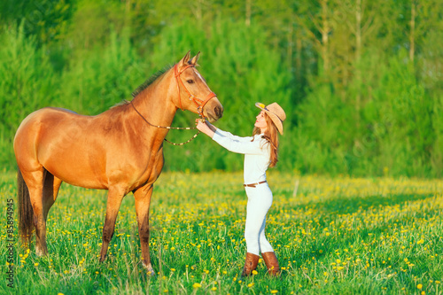 Girl in a hat with a horse   © svetastar