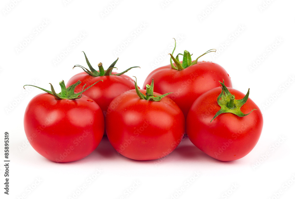 Fresh tomatoes with green leaves isolated on white background Fresh tomatoes with green leaves isolated on white background