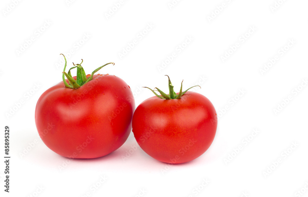Fresh tomatoes with green leaves isolated on white background Fresh tomatoes with green leaves isolated on white background