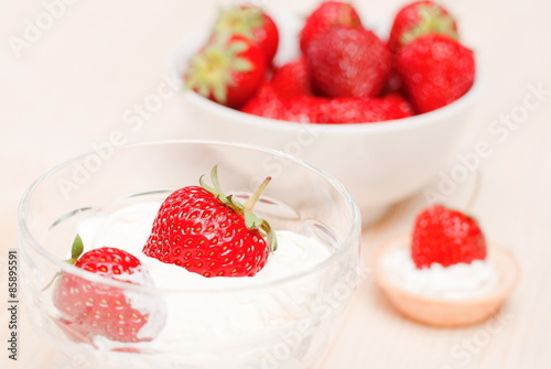 Tartlets with strawberry and cream close dishes with strawberrie