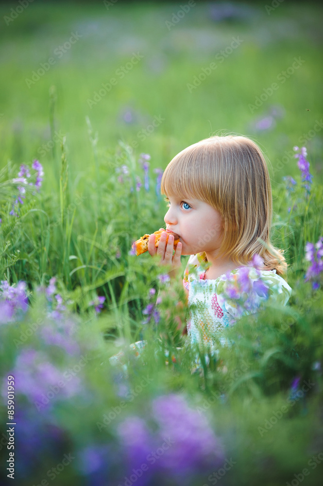 Cute cheerful blond girl playing in the park Cute cheerful blond girl playing in the park