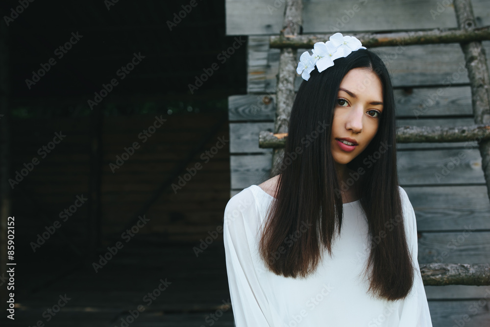 Fototapeta premium Girl climbing ladder into tree house