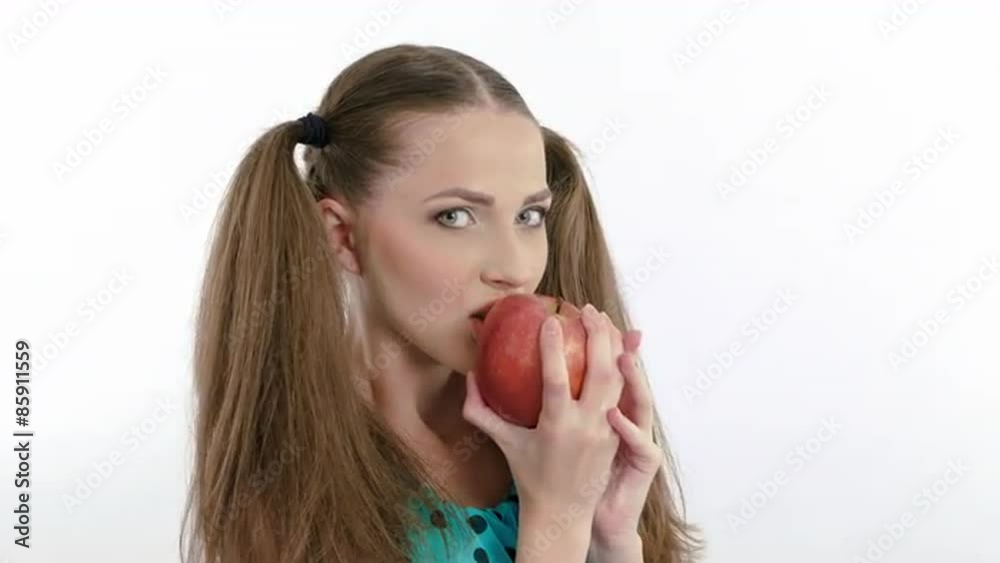 Attractive model eating an red apple on white background. With Attractive model eating an red apple on white background. With