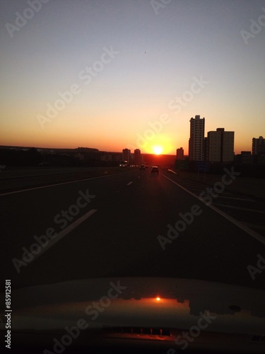 Inside car view of a beautiful sunsst onthe road photo