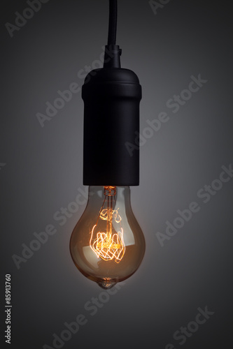 Vintage light bulb glowing