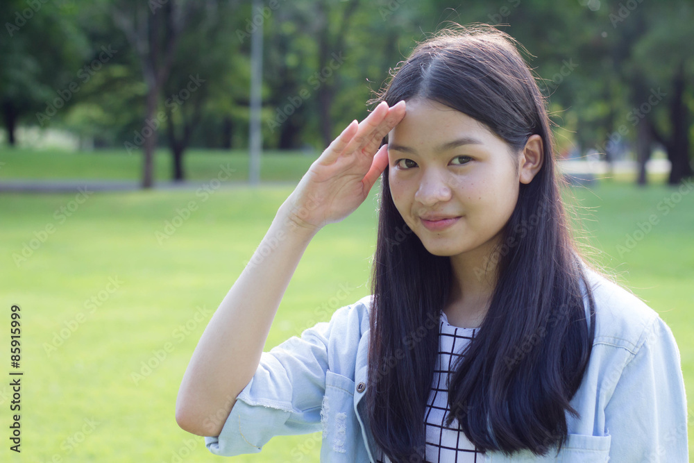 Portrait of thai student teen beautiful girl Dress white happy and relax On Park Portrait of thai student teen beautiful girl Dress white happy and relax On Park