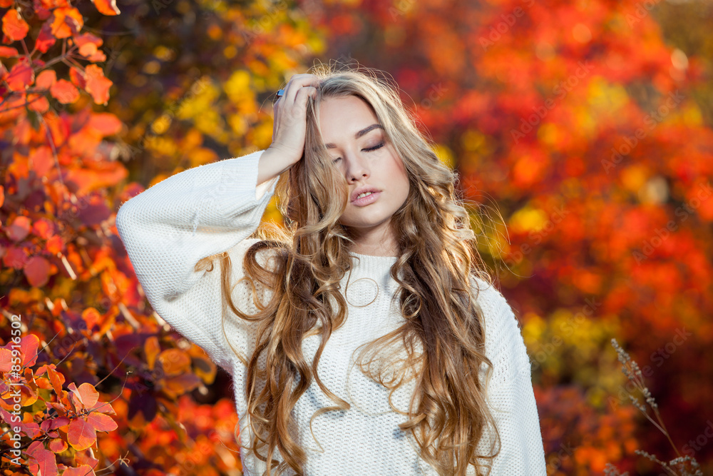 beautiful young woman with curly hair against a background of beautiful young woman with curly hair against a background of