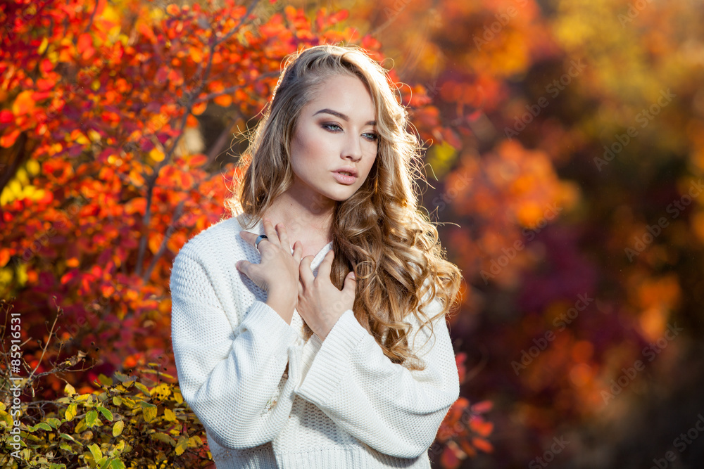 beautiful young woman with curly hair against a background of beautiful young woman with curly hair against a background of