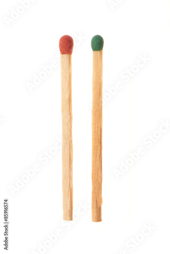 Green and red wooden matches isolated on white background
