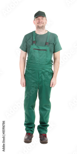 Worker in green overalls