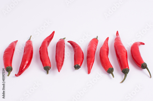 Red chillies on white background
