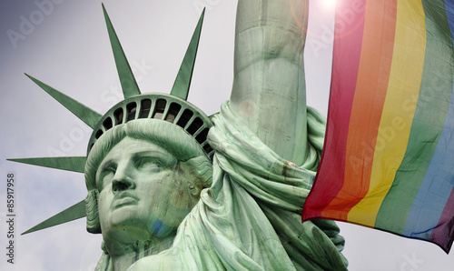 Statue of liberty in New York and rainbow flag 