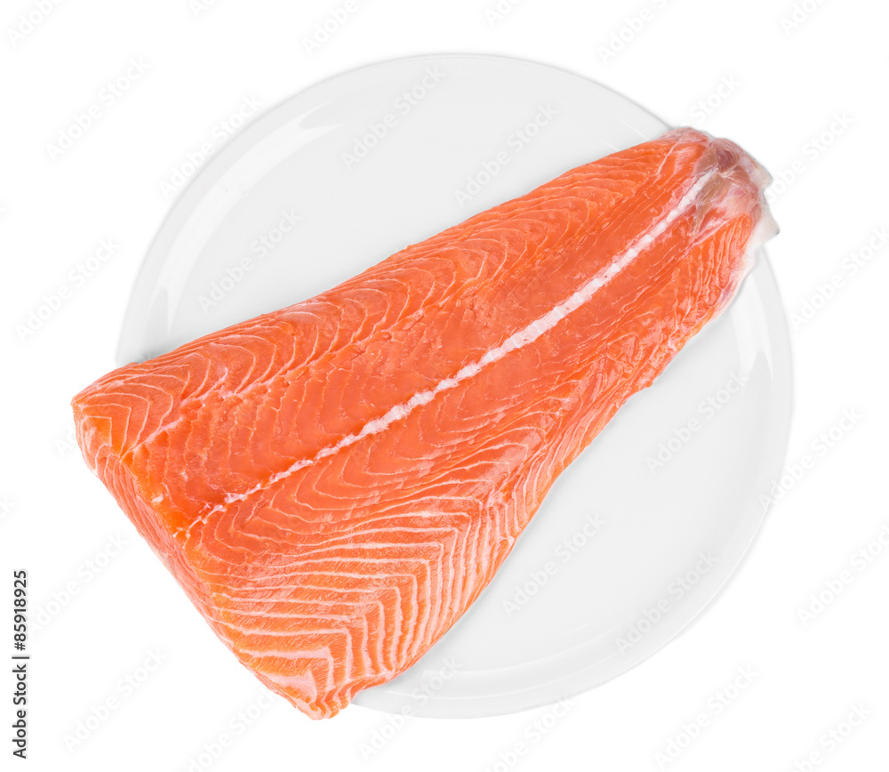 Raw salmon fillet on plate. Raw salmon fillet on plate.