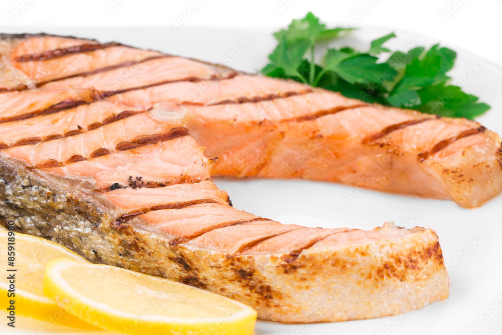 Grilled salmon steak with vegetables on plate. Grilled salmon steak with vegetables on plate.