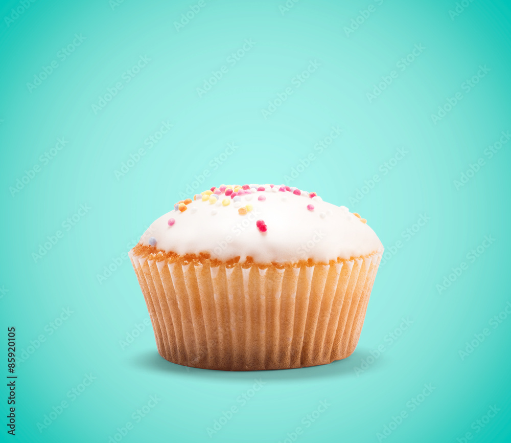 Cupcake isolated on blue background Cupcake isolated on blue background