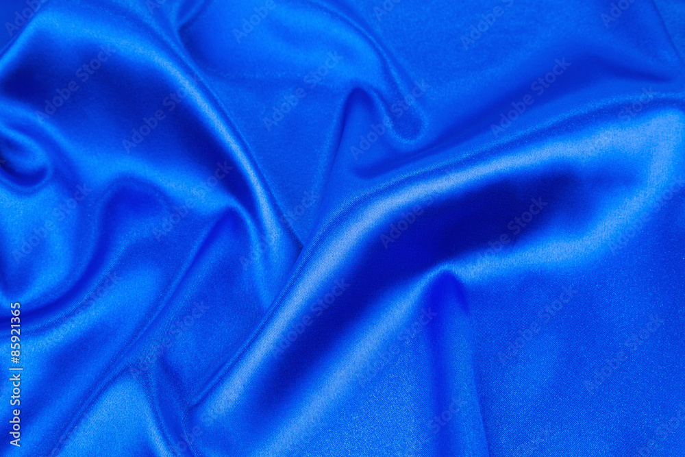 Soft folds of deep blue cloth texture. Soft folds of deep blue cloth texture.