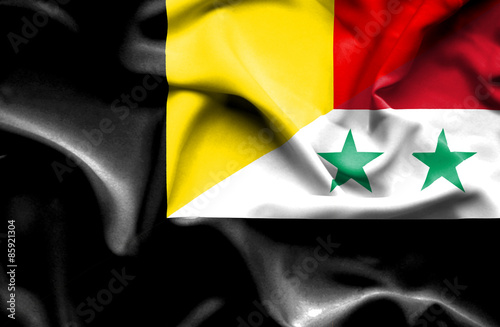 Waving flag of Syria and Belgium