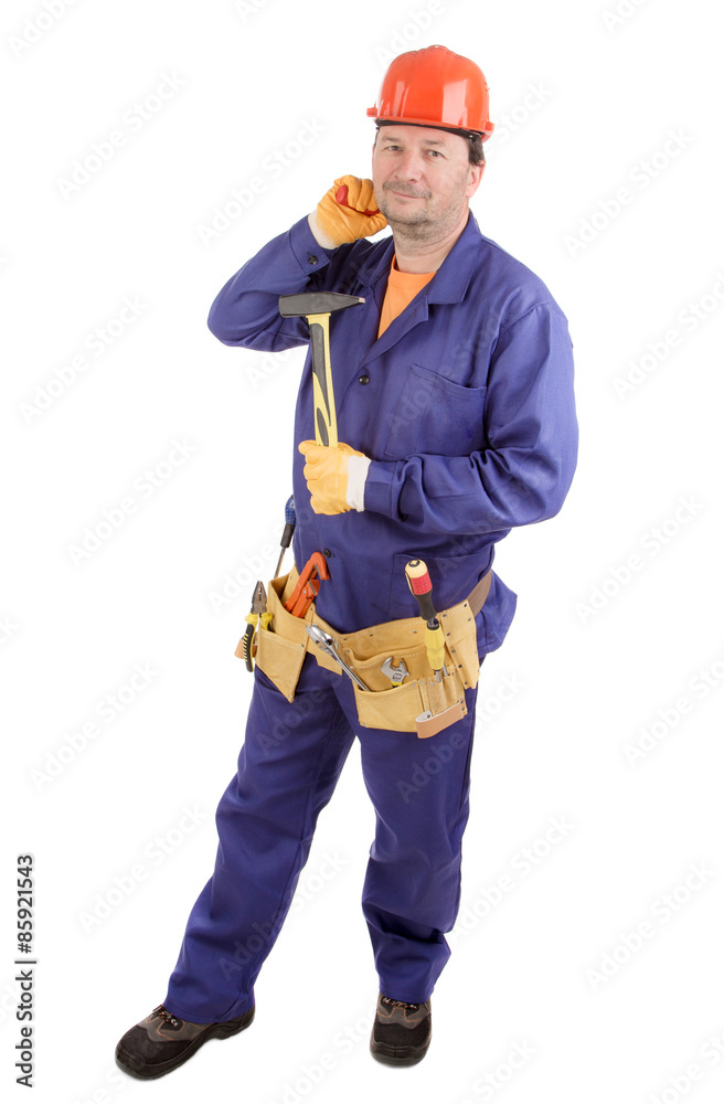 Worker in hard hat holding hammer.