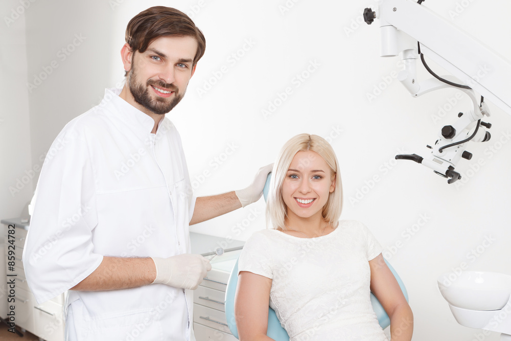 Fototapeta premium Portrait of smiling dentist and patient