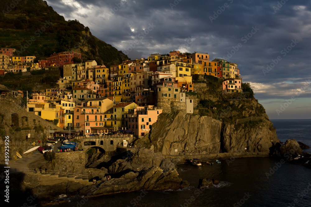 View of Manarola and its harbour at sunset