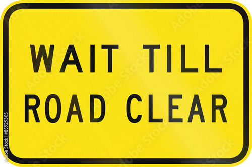 An Australian warning traffic sign - Wait till road clear